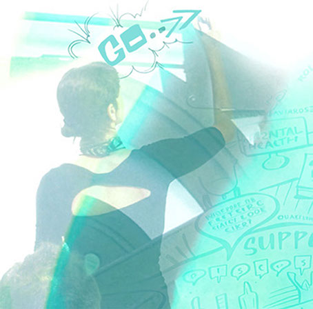 Rachel Dight, Creative Director at Swivel Creative, creating a large-scale visual mural during a collaborative workshop.